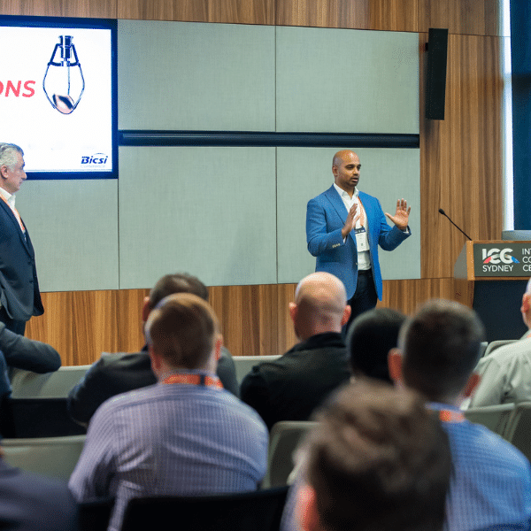 Man presenting to a crowd of people