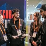 visitors connecting in front of security exhibition entrance